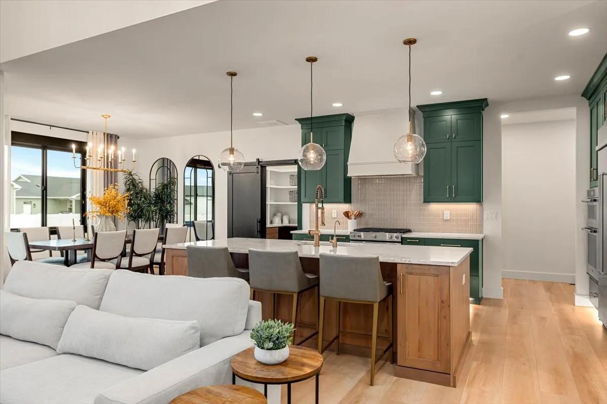 Rustic Beech island in Almond stain with Shade Grown American Collection cabinets beyond, from Kitchens Plus MT